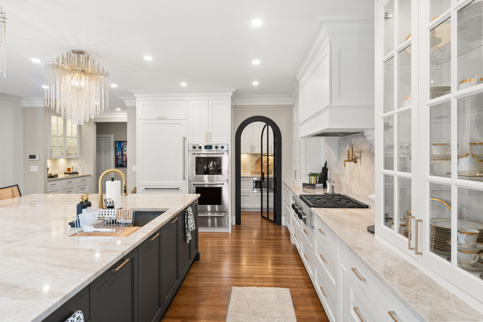 Custom renovated kitchen with stone island, premium appliances and tailored cabinetry